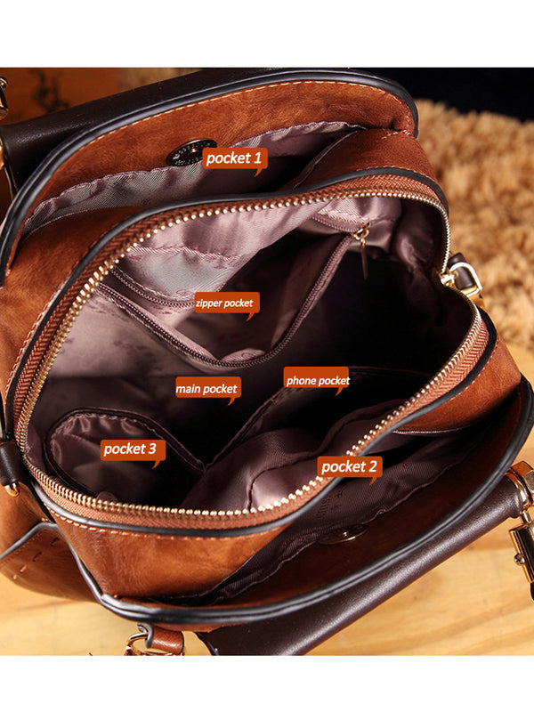 Vintage kožené kabelky kulatého tvaru se střapci. Taška přes rameno