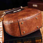 Vintage kožené kabelky kulatého tvaru se střapci. Taška přes rameno